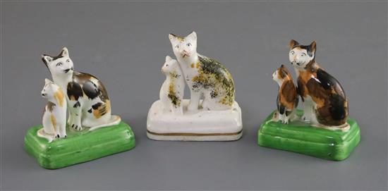 Three Staffordshire porcelain groups of a cat and kitten, c.1835-50, H. 6cm - 6.2cm, slight faults